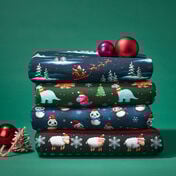 Jultyger Jultyger med tomtar, snögubbar, jultomte och renar i röda nyanser